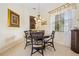 A charming dining room features a round table with seating for four and a stylish wine rack at 265 White Marsh Ln, Rotonda West, FL 33947