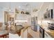 Modern kitchen with stainless steel appliances, ample counter space, and stylish white cabinetry at 265 White Marsh Ln, Rotonda West, FL 33947