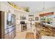 Bright kitchen with stainless appliances and stone countertops, with an oven and built-in microwave at 265 White Marsh Ln, Rotonda West, FL 33947