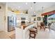 Eat-in kitchen with white cabinets, stainless steel appliances, and a view of the lanai at 265 White Marsh Ln, Rotonda West, FL 33947
