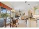 Bright and airy living space with access to pool, chandelier, and comfortable seating at 265 White Marsh Ln, Rotonda West, FL 33947