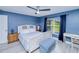 Bedroom with large windows for natural light, desk, and ceiling fan at 2685 Nanette Ln, North Port, FL 34286