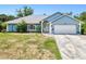 Charming single-story home with a well-manicured lawn and attached two-car garage at 2685 Nanette Ln, North Port, FL 34286