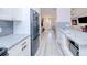 Open kitchen with granite counters and stainless appliances provides seamless flow to other living areas at 2685 Nanette Ln, North Port, FL 34286