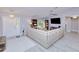 Inviting living room with gray walls and flooring and a large comfortable sofa at 2685 Nanette Ln, North Port, FL 34286