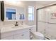 Updated main bathroom with a glass shower, modern vanity, and black and white decorative floor tiles at 2685 Nanette Ln, North Port, FL 34286