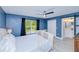 Inviting main bedroom features neutral tones, natural light, and en-suite bathroom with sliding barn door at 2685 Nanette Ln, North Port, FL 34286
