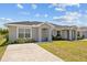 Charming single-story duplex featuring a well-manicured lawn and a private driveway at 27237 Partin Dr, Punta Gorda, FL 33983