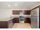 Stylish kitchen with stainless steel appliances, modern cabinetry, and granite countertops at 27237 Partin Dr, Punta Gorda, FL 33983