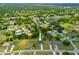 Drone shot of the property's location within a lush, green neighborhood at 27263 Deep Creek Blvd, Punta Gorda, FL 33983