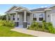 Inviting front porch with decorative stone pillars and lush landscaping at 27263 Deep Creek Blvd, Punta Gorda, FL 33983