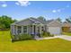 Charming single-story home boasts manicured landscaping and a freshly painted exterior at 27263 Deep Creek Blvd, Punta Gorda, FL 33983
