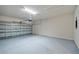 Spacious garage with epoxy flooring and an automatic door opener at 27263 Deep Creek Blvd, Punta Gorda, FL 33983