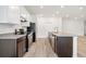 Modern kitchen with stainless steel appliances, granite countertops, and an island with a sink and faucet at 27263 Deep Creek Blvd, Punta Gorda, FL 33983