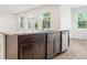 Kitchen island with granite countertops, stainless steel appliances, sink with a faucet, dark wood cabinets at 27263 Deep Creek Blvd, Punta Gorda, FL 33983