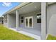 Covered patio with gray columns, perfect for outdoor lounging at 27263 Deep Creek Blvd, Punta Gorda, FL 33983