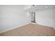 Tiled basement offers versatile space with neutral tones and a separate door at 31 Oberlin Rd, Venice, FL 34293
