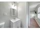 Well-lit bathroom features a modern vanity and a framed mirror at 31 Oberlin Rd, Venice, FL 34293