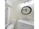 Well-lit bathroom with updated vanity, sink, and a shower featuring a shower head at 31 Oberlin Rd, Venice, FL 34293