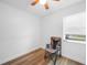 Bright bedroom with hardwood floors, ceiling fan, and window, offering comfort and natural light at 31 Oberlin Rd, Venice, FL 34293