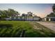 Inviting single-story home with a lush green lawn, mature trees, and a welcoming facade at 31 Oberlin Rd, Venice, FL 34293