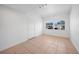 Bright room featuring tiled floors, a window, and a door at 31 Oberlin Rd, Venice, FL 34293