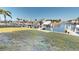 Lush backyard with waterfront canal access and private boat docks for boating enthusiasts at 311 Garvin St # 405A, Punta Gorda, FL 33950