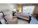 The bedroom is well lit from a window with water views and has comfortable furniture at 311 Garvin St # 405A, Punta Gorda, FL 33950