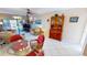 The dining room is connected to the living room and contains wicker seating and a chandelier at 311 Garvin St # 405A, Punta Gorda, FL 33950