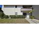 Charming condo entrance with a private balcony and lush landscaping at 311 Garvin St # 405A, Punta Gorda, FL 33950