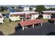 Exterior view of condominium with carport parking, well-maintained landscaping, and water access at 311 Garvin St # 405A, Punta Gorda, FL 33950