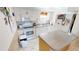 Functional kitchen featuring white cabinetry, modern appliances, and ample countertop space at 311 Garvin St # 405A, Punta Gorda, FL 33950