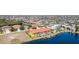 Aerial view of the waterfront community with water access and lush landscaping at 3228 Purple Martin Dr # 116, Punta Gorda, FL 33950