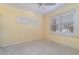 This is a spare bedroom with neutral carpet and a window with shutters allowing natural light at 3228 Purple Martin Dr # 116, Punta Gorda, FL 33950