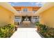 Welcoming building entrance with a fountain, mature landscaping, and decorative lighting at 3228 Purple Martin Dr # 116, Punta Gorda, FL 33950