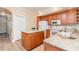 Functional kitchen with a central island, plentiful cabinets, and modern appliances at 3228 Purple Martin Dr # 116, Punta Gorda, FL 33950