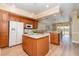 Bright kitchen featuring granite countertops, an island, and seamless flow into the living area at 3228 Purple Martin Dr # 116, Punta Gorda, FL 33950