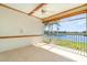 A relaxing lanai with tile flooring and views of the water and tropical landscaping at 3228 Purple Martin Dr # 116, Punta Gorda, FL 33950
