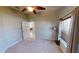 Bedroom with soft carpet and large windows, offering a serene view and ample natural light at 327 Monaco Dr # 12, Punta Gorda, FL 33950