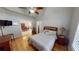 Bedroom with decorative furnishings, a ceiling fan, and seamless transition into the adjacent dining area at 327 Monaco Dr # 12, Punta Gorda, FL 33950