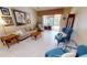 Bright living room featuring tile floors, comfortable seating, and sliding door access to outdoor spaces at 327 Monaco Dr # 12, Punta Gorda, FL 33950