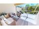 Relaxing covered patio featuring comfortable wicker furniture and decorative accents provides a cozy outdoor living space at 327 Monaco Dr # 12, Punta Gorda, FL 33950