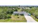 Aerial shot of the property showcasing a well-maintained home and lush surroundings at 4229 Cockrell St, Port Charlotte, FL 33948