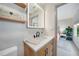 This bathroom boasts a floating vanity with quartz countertop and sleek black hardware at 4229 Cockrell St, Port Charlotte, FL 33948