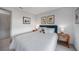 This bedroom offers natural light, white bedding and neutral colors at 4229 Cockrell St, Port Charlotte, FL 33948