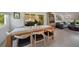 View of the dining area with seating for four, seamlessly flowing into the living room area at 4229 Cockrell St, Port Charlotte, FL 33948