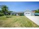Charming home with a well-manicured lawn, and a convenient two-car garage at 4229 Cockrell St, Port Charlotte, FL 33948