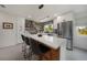 Modern kitchen with quartz countertops, stainless steel appliances, and a stylish center island with seating at 4229 Cockrell St, Port Charlotte, FL 33948
