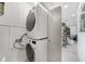 Modern laundry room with stacked washer and dryer units, and convenient access to the interior at 4229 Cockrell St, Port Charlotte, FL 33948
