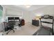 This home office has dual monitors and plenty of room for exercise equipment at 4229 Cockrell St, Port Charlotte, FL 33948